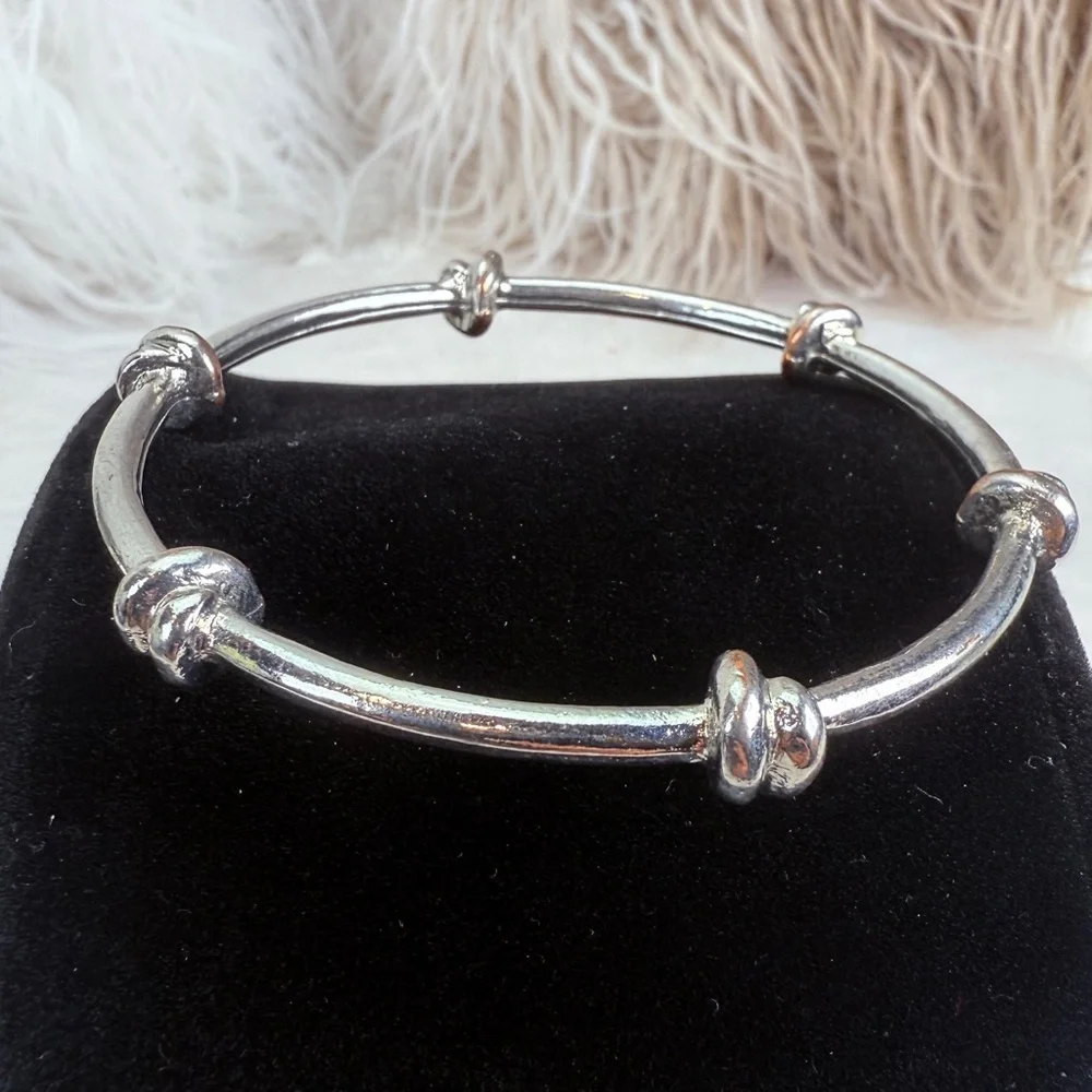 Pretty Silvertone weighted knotted bangle stacking bracelet